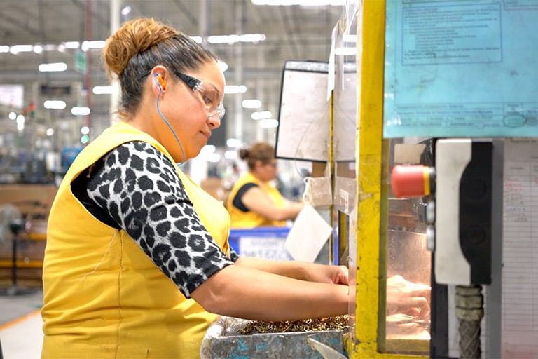 Worker woman in yellow vest