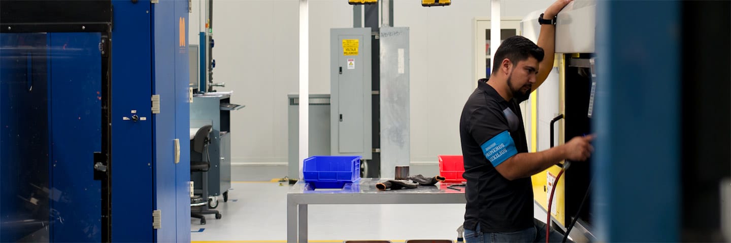 Man in front of machine
